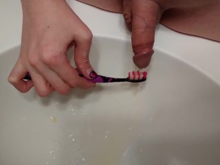 Trans girl brushes her teeth with her own piss